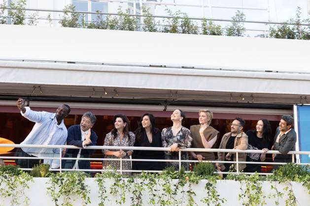 Cannes - Jury Dinner Ahead Of The Festival Opening Members of the Jury the 77th edition of the Cannes Film Festival French actor and comedian Omar Sy take a selfie with Japanese director Kore-eda Hirokazu, Turkish actress and screenwriter Ebru Ceylan, Lebanese director Nadine Labaki, US actress Lily Gladstone, US director and president of the Jury of the 77th Cannes Film Festival Greta Gerwig, Spanish director, producer, and writer Juan Antonio Bayona, French actress Eva Green and Italian actor Pierfrancesco Favino during a dinner of the jury at the Grand Hyatt Cannes Hotel Martinez, on the eve of the opening ceremony of the 77th edition of the Cannes Film Festival. The 77th Cannes Film Festival on May 13, 2024 in Cannes, France. Photo by S Copyright: xShootpix ABACAx