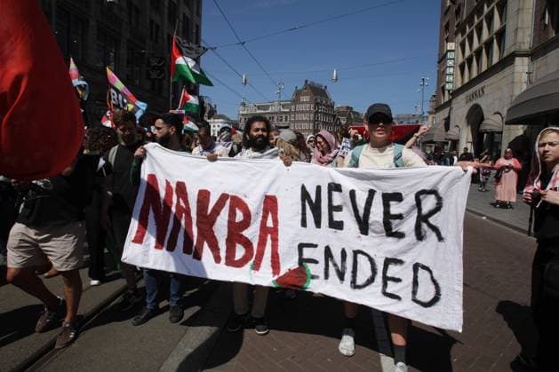 People take part during march protest to commemorate the 76th anniversary of the Nakba and against the ongoing conflict Israel and the Palestinian at the Dam Square on May 11, 2024 in Amsterdam,Netherlands. Nakba Day marks the anniversary of the some 700,000 Palestinians fled or were expelled on Israel s founding in 1948. Amsterdam Netherlands Copyright: xPauloxAmorimx xVWPicsx amp20240511_009