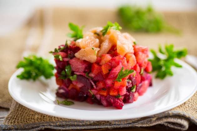 vinaigrette salad of boiled vegetables with salted fish in a plate vinaigrette salad of boiled vegetables with salted fish in a plate, on a wooden table. Copyright: xPeredniankina RECORD DATE NOT STATED