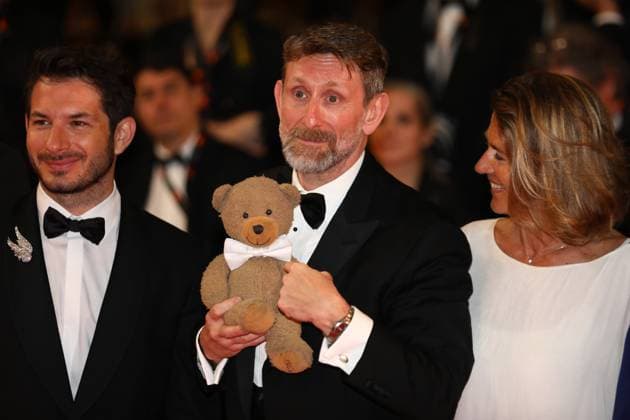 May 18, 2024, Cannes, Cote D azur, France: HERTZOG DESSITES holds a teddy bear plush as he walks the red carpet ahead of the Rumours Premiere screening at the 77th Annual Cannes Film Festival at Palais des Festivals in Cannes, France Cannes France - ZUMAc179 20240518_zep_c179_205 Copyright: xMickaelxChavetx