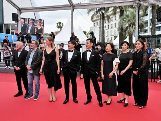 Cannes, France: Cannes, 77th Cannes Film Festival 2024, Sixth evening - red carpet Palma d Or Studio Ghibli - In the photo: Vincent Maraval, Livia Van Der Staay, Kenichi Yoda, and Goro Miyazaki Cannes France  - ZUMAp169 20240520_zea_p169_649 Copyright: xManuelexMangiarottix