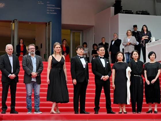 Cannes, France: Cannes, 77th Cannes Film Festival 2024, Sixth evening - red carpet Palma d Or Studio Ghibli - In the photo: Vincent Maraval, Livia Van Der Staay, Kenichi Yoda, and Goro Miyazaki Cannes France  - ZUMAp169 20240520_zea_p169_650 Copyright: xManuelexMangiarottix