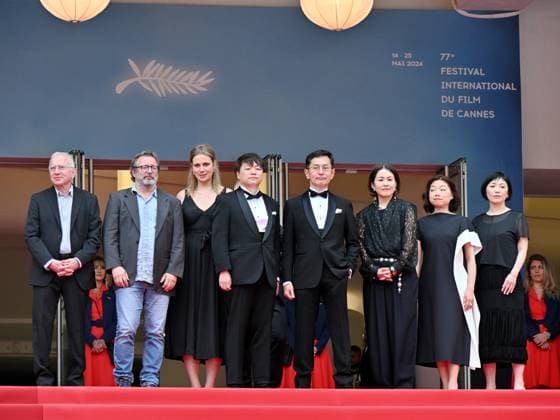 Cannes, France: Cannes, 77th Cannes Film Festival 2024, Sixth evening - red carpet Palma d Or Studio Ghibli - In the photo: Vincent Maraval, Livia Van Der Staay, Kenichi Yoda, and Goro Miyazaki Cannes France  - ZUMAp169 20240520_zea_p169_660 Copyright: xManuelexMangiarottix
