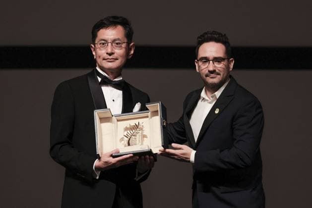 Cannes Palme D Or D Honneur To Studio Ghibli Ceremony DB Goro Miyazaki (L) receives the award from jury member Juan Antonio Bayona (C) and president of the festival Iris Knobloch (R) during the ceremony for the Palme D Or D Honneur to Studio Ghibli at the 77th annual Cannes Film Festival at Palais des Festivals on May 20, 2024 in Cannes, France. Photo by David Boyer ABACAPRESS.COM Cannes France  Copyright: xBoyerxDavid ABACAx