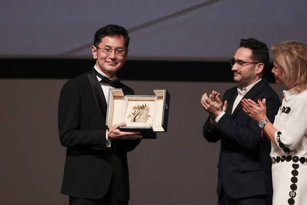 Cannes Palme D Or D Honneur To Studio Ghibli Ceremony DB Goro Miyazaki (L) receives the award from jury member Juan Antonio Bayona (C) and president of the festival Iris Knobloch (R) during the ceremony for the Palme D Or D Honneur to Studio Ghibli at the 77th annual Cannes Film Festival at Palais des Festivals on May 20, 2024 in Cannes, France. Photo by David Boyer ABACAPRESS.COM Cannes France  Copyright: xBoyerxDavid ABACAx
