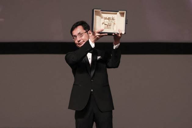 Cannes Palme D Or D Honneur To Studio Ghibli Ceremony DB Goro Miyazaki poses with the award during the ceremony for the Palme D Or D Honneur to Studio Ghibli at the 77th annual Cannes Film Festival at Palais des Festivals on May 20, 2024 in Cannes, France. Photo by David Boyer ABACAPRESS.COM Cannes France  Copyright: xBoyerxDavid ABACAx