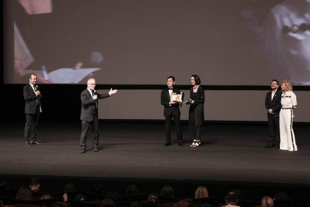 Cannes Palme D Or D Honneur To Studio Ghibli Ceremony DB Goro Miyazaki (L) receives the award from jury member Juan Antonio Bayona (C) and president of the festival Iris Knobloch (R) during the ceremony for the Palme D Or D Honneur to Studio Ghibli at the 77th annual Cannes Film Festival at Palais des Festivals on May 20, 2024 in Cannes, France. Photo by David Boyer ABACAPRESS.COM Cannes France  Copyright: xBoyerxDavid ABACAx