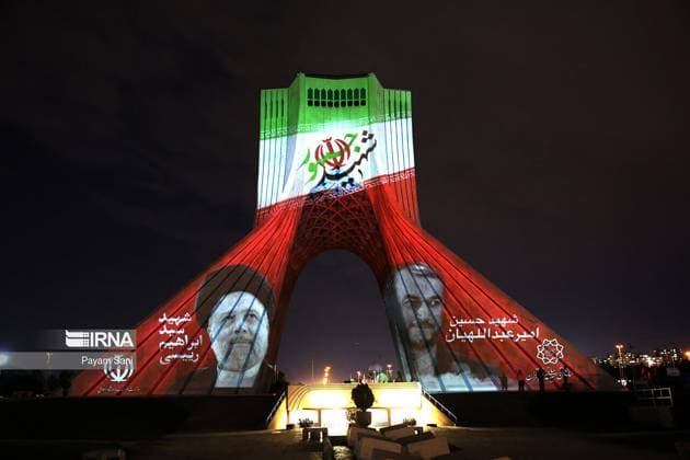 A picture of the late Iranian President Ebrahim Raisi is seen on a street in Tehran in Iran, on Tuesday, May 21, 2024. Raisi was confirmed dead along with his foreign minister Hossein Amir-Abdollahian and six others on May 20, 2024, after search and rescue teams found their crashed helicopter in a fog-shrouded mountain region in Iran s East Azerbaijan province.  IRN2024052140 IslamicxRepublicxNewsxAgencyxIRN