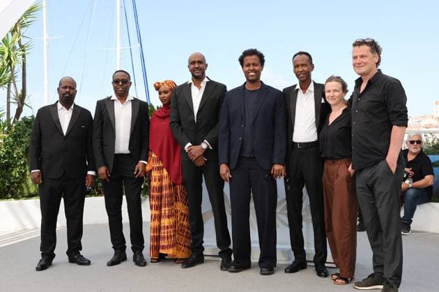 Cannes - The Village Next To Paradise Photocall Mohamed Jama, Abdimalik Yusuf, Anab Ahmed Ibrahim, Ahmed Farah, Mo Harawe, Ahmed Ali Farah, Sabine Moser and Oliver Neumann attend the The Village Next To Paradise Photocall at the 77th annual Cannes Film Festival at Palais des Festivals on May 22, 2024 in Cannes, France. Photo by Shootpix ABACAPRESS.COM Cannes France  Copyright: xShootpix ABACAx