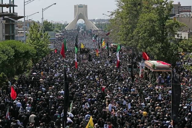 News Themen der Woche KW21 May 22, 2024, Tehran, Iran: Iranians mourners follow a truck carrying coffins of the late President Ebrahim Raisi and his companions, who were killed in a helicopter crash in a mountainous region of the country s northwest, during a funeral ceremony for them in Tehran. Iran s supreme leader presided over the funeral Wednesday for the country s late president, foreign minister, and others killed in the helicopter crash, as tens of thousands later followed a procession of their caskets through the capital, Tehran. Tehran Iran - ZUMAi98_ 20240522_zih_i98_096 Copyright: xIranianxPresidencyx