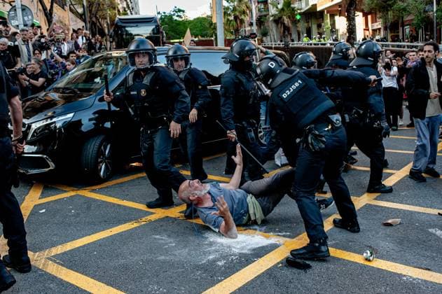 May 23, 2024, Barcelona, Spain: In the Park Guell neighborhood of Barcelona a man is detained by police officers during a protest against the Louis Vuitton fashion show. Barcelona residents gathered around Park GoÂ¼ell in Barcelona against the Louis Vuitton fashion show and protesting various social issues such as mass tourism, gentrification, animal rights or the commercialization and privatization of public spaces by the city council. Barcelona Spain - ZUMAb137 20240523_fap_b137_011 Copyright: xJordixBoixareux