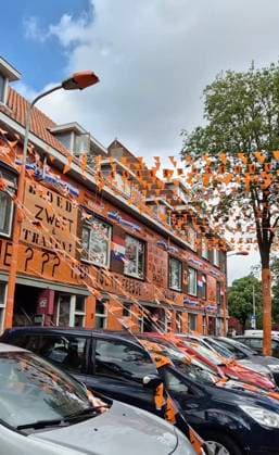 Family turns entire street ORANGE to celebrate start of Euros Story from Jam Press (Euros Celebration) Pictured: Video grab of the orange street ready to celebrate the Euros. Family turns entire street ORANGE to celebrate start of Euros An entire street has turned orange in celebration of the beginning of the UEFA Euros 2024. The road has been decorated with flags, while buildings and trees have been draped with tarpaulin. The thrifty family responsible says they have been stringing up decorations every two years since 1988, and around 15 of their friends come to help them. It has already taken them six weeks - and they won™t stop until the day of the first match. There are still some flags to hang - in total there will be 65 k  Copyright: xJamxPressxVid @marktweg_oranjestraat