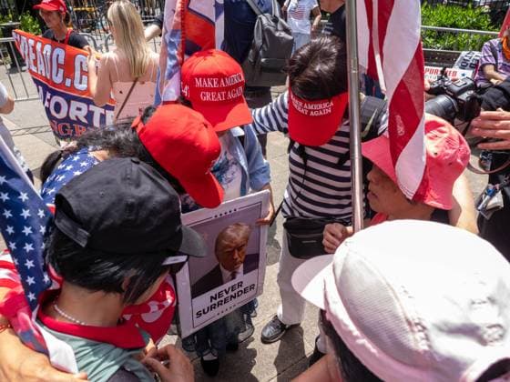 May 29, 2024, New York, New York, USA: A group of Chinese women bow their heads and pray for Trump. Deliberations in the Donald TrumpÃ¢â‚¬Ëœs hush money case start this morning. These are scenes across the street from the court building. A good number of Republicans, mostly Trump supporters gathered in Collect Pond Park with banners and flags praising Donald Trump. New York USA - ZUMAc266 20240529_znp_c266_010 Copyright: xCarlosxChiossonex