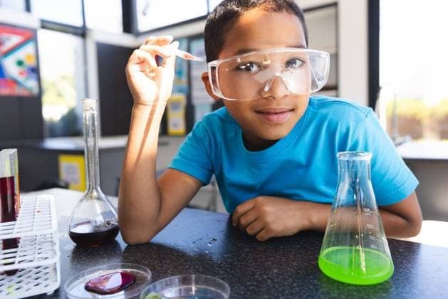 Biracial boy engages in a science experiment at school in the classroom Biracial boy engages in a science experiment at school in the classroom. Wearing safety goggles, he explores chemistry with curiosity and focus., model released, , property released, Cape Town, South Africa, 2023-12-01T22:00:00.000Z, 5028935.jpg, people,biracial,boy,science experiment,school,classroom,safety goggles,chemistry,curiosity,focus,education,learning,student,studying,experiment,exploration,STEM,laboratory,scientific,diversity,multiracial,hands-on,practical,discovery,investigation,knowledge,childhood,young,elementary,child,schoolwork,task,project,ethnic,mixed-race,safety,beaker,test tubes,microscope,equipment,tools,research,analysis,inquiry,youthful,lab coat,c