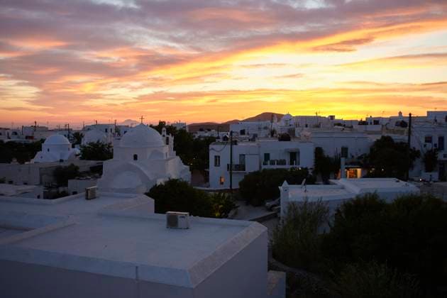 Sunset over a serene town with buildings displaying the iconic whitewashed architecture under a dramatic sky. Folegandros Greece bola01013 Copyright: xConnectxImagesx