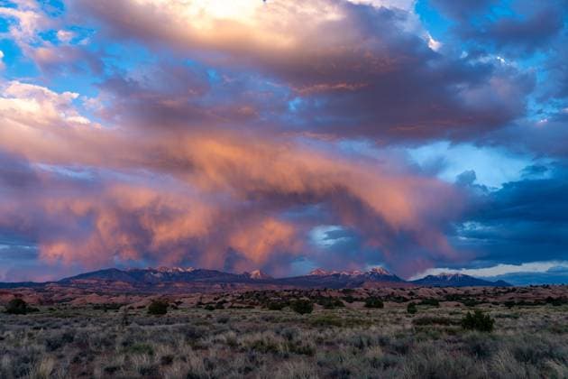 Creative Highlights World Colorful sunset clouds over the La Sal Mountains near Moab, Utah. Moab Sand Flats Recreation Area Utah United States Copyright: xJonxG.xFullerx xVWPicsx 7847-JGF-sunset-LaSalMountains-US-UT