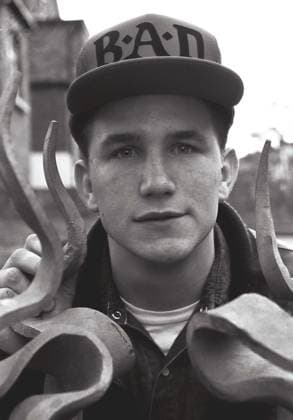 Laul Clements looks through railings and is wearing a Big Audio Dynamite basebal Laul Clements looks through railings and is wearing a Big Audio Dynamite baseball cap,1986,  Copyright: xMarkxCharnockx xAvalonx 0531870740