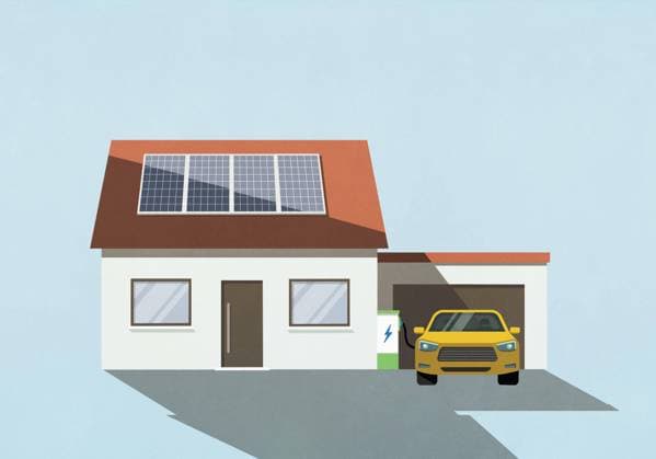 Electric car charging in driveway of house with solar panels on roof  Copyright: MaltexMueller fStopImages2073025