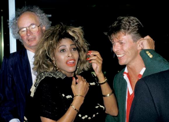 TINA TURNER & DAVID BOWIE.London, England, Circa 1985.half length arms hands red lips lipstick red white stripe shirt green jacket eighties 80 s gold bracelets.CAP PL. Phil Loftus London Great Britain Copyright: xPhilxLoftus CapitalxPicturesx