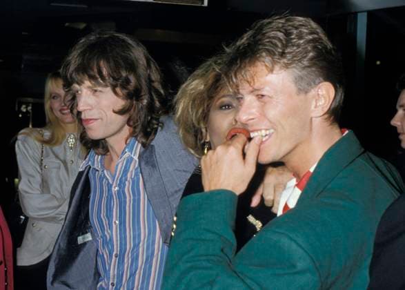 JERRY HALL, MICK JAGGER, TINA TURNER & DAVID BOWIE.London, England, Circa 1985.half length red lips lipstick red white stripe shirt green jacket eighties 80 s blue married couple divorced husband wife.CAP PL. Phil Loftus London Great Britain Copyright: xPhilxLoftus CapitalxPicturesx