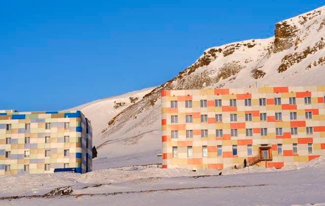 Creative Highlights World Residential area for the miners. Russian coal mining town Barentsburg at fjord Groenfjorden, Svalbard. The coal mine is still in operation. Arctic Region, Europe, Scandinavia, Norway, Svalbard Residential area for the miners. Russian coal mining town Barentsburg at fjord Groenfjorden, Svalbard. The coal mine is still in operation. Arctic Region, Europe, Scandinavia, Norway, Svalbard Copyright: Â¬ MartinZwick REDA&CO 1028_11_MZW16047