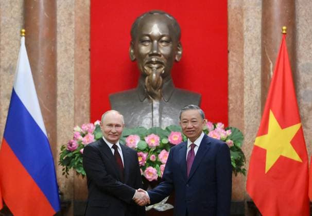 Russia s President Vladimir Putin (L) and Vietnam s President To Lam (R) shake hands at the Presidential Palace in Hanoi Vietnam, on Thursday on June 20, 2024. Russia and Vietnam pledged on June 20, 2024 to deepen ties as President Vladimir Putin made a state visit aimed at bolstering his alliances to counter Moscow s growing isolation over the war in Ukraine.  VIT2024062012 Kremlin