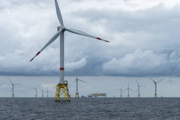 Offshore wind farm Nordsee Ost, operator RWE, north of Helgoland, German economic zone, wind turbines with jacket foundation structure, low swell, supply station, ship tug, Germany, Europe *** Offshore Wind Farm North Sea East, Operator RWE, North of Heligoland, German Economic zone, Wind turbines With Jacket Foundation structure, Low swell, Supply station, Ship tug, Germany, Europe Copyright: imageBROKER WolfgangxDiederich ibldie10814020.jpg