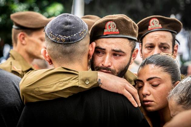 News Themen der Woche KW25 News Bilder des Tages Funeral of Omer Smadga An Israeli soldier hugs a friend during the funeral of fallen soldier Omer Smadga, at the military cemetery in Netanya Friday, June 21, 2024. Smadga died in combat with Hamas in the Gaza Strip Thursday. His Father, Oren, spoke over his grave and called on the Idf to keep fighting as hard as possible, I m telling the soldiers here to keep their heads up. Keep going as hard as possible. Don t stop until we win. This is my message to anyone in combat. Am Israel Hai,Ó. Oren Smadga is the Israeli Olympic medalist in judo from the Barcelona 1992 Olympics and the current coach of the Israeli judo team, Photo by Eyal Warshavsky. Netanya Israel Copyright: xEyalxWarshavskyx