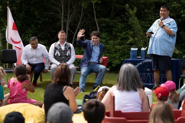 June 21, 2024, WeöÄÃ KoqmaöÄÃ Q First Nat, Ns, Canada: Prime Minister Justin Trudeau acknowledges the crowd while listening to Phillip Prosper, a Mi kmaq storyteller, during an event for National Indigenous Peoples Day in WeöÄÃ koqmaöÄÃ q First Nation, N.S. on Friday, June 21, 2024. WeöÄÃ KoqmaöÄÃ Q First Nat Canada  - ZUMAc35_ 20240621_zaf_c35_019 Copyright: xDarrenxCalabresex