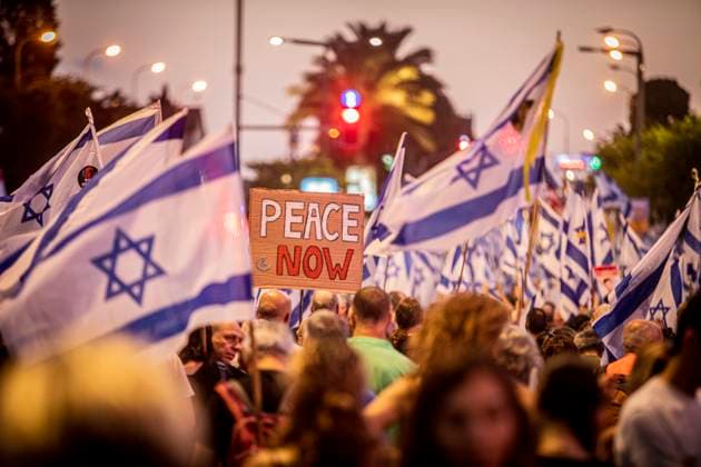 News Themen der Woche KW25 Anti Government Protest in Tel Aviv A sign that readsÓPeace NowÓ is seen among a sea of Israeli flags during a demonstration in Tel Aviv, Saturday, June 22 2024. Tens of thousands anti-government protesters demonstrated in Tel Aviv, calling for Israel to press ahead with a deal to release hostages held by Hamas in Gaza, to end the war and for the ouster of Prime Minister Benjamin Netanyahu and early elections. Photo by Eyal Warshavsky. Tel Aviv Israel Copyright: xEyalxWarshavskyx