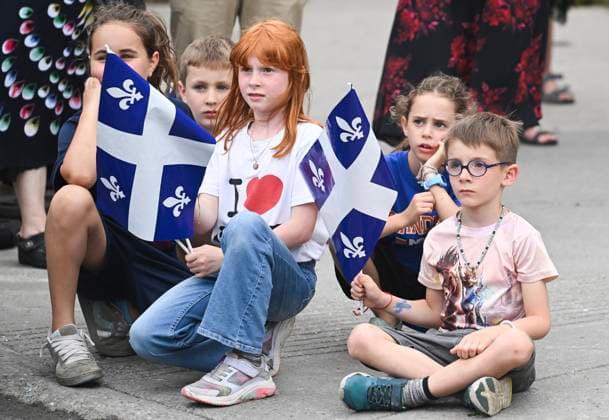 June 23, 2024, Montreal, Pq, Canada: Children hold Quebec flags as they attend a FÂte Nationale event in Montreal, Sunday, June 23, 2024. Montreal Canada  - ZUMAc35_ 20240623_zaf_c35_026 Copyright: xGrahamxHughesx