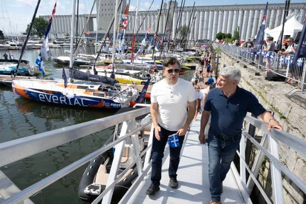 June 24, 2024, Quebec, Pq, Canada: Conservative Leader Pierre Poilievre and MP Gerard Deltell, right, chat after visiting the docks while touring for the Fete Nationale, Monday, June 24, 2024 in Quebec City. Quebec Canada  - ZUMAc35_ 20240624_zaf_c35_039 Copyright: xJacquesxBoissinotx