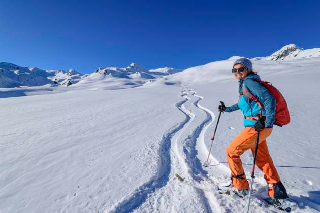 Happy mature woman back country skiing with ski poles at Schwebenkopf, Kurzer Grund, Kitzbuehel Alps, Tyrol, Austria model released, Symbolfoto, ANSF00901