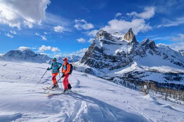 Couple hiking on snowcapped Dolomites mountains in Veneto, Italy model released, Symbolfoto, ANSF00973
