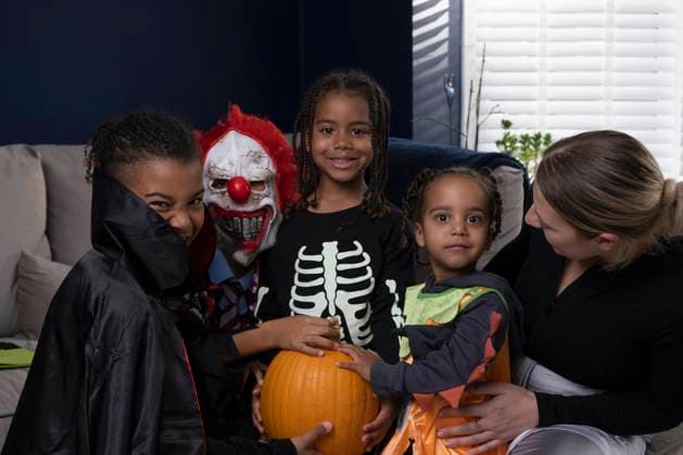 Portrait of smiling family in Halloween costumes at home model released Copyright: xCCOx