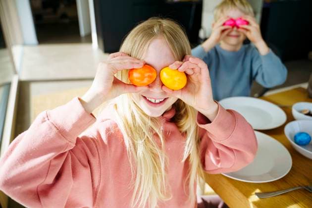 Happy siblings playing with colored eggs on Easter day model released, Symbolfoto property released, NJAF01126