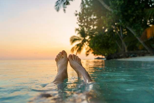 Creative Highlights Symbolbilder Woman™s legs in sea at sunset model released, Symbolfoto, NSTF00106