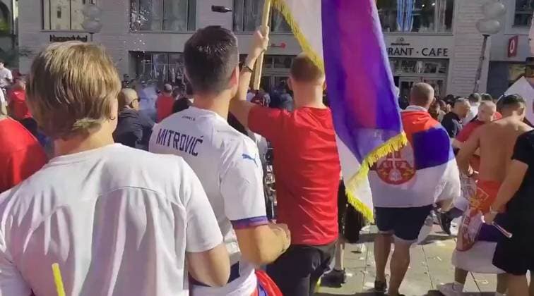 VIDEO: Serbian footy thugs lob beer bottles at German cops in ugly Euro 2024 scenes Story from Jam Press (Serbian Fans Throw Bottles) Pictured: A video grab of Serbian football thugs lobbing beer bottles at German riot cops. VIDEO: Serbian footy thugs lob beer bottles at German cops in ugly Euro 2024 scenes Serbian football thugs lobbed beer bottles at German riot cops in ugly scenes at Euro 2024. A mob of supporters targeted the police officers in the main square in Munich. It was ahead of their match last (25 Jun) night with Denmark that ended 0-0. Serbia, in Group C along with England, were knocked out after finishing bottom. Some of their fans were topless, while others were clad in their football shirts and draped in their nati  Copyright: xJamxPressxVid @footbalIfights