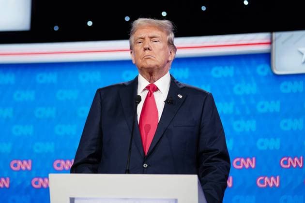Former President Donald Trump stands on the stage during a break in the CNN presidential election debate against President Joe Biden in Atlanta, Georgia on Thursday, June 27, 2024. The debate will be held in CNN s Atlanta studios with Jake Tapper and Dana Bash as moderators.  ATL20240627205 ELIJAHxNOUVELAGE