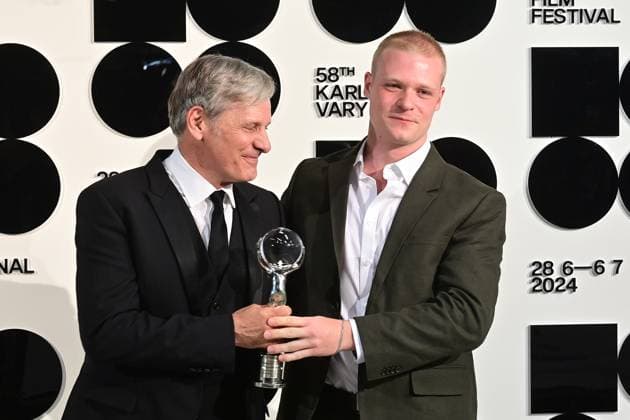 American actor Viggo Mortensen, left, received the President s Award during the opening ceremony of the 58th Karlovy Vary International Film Festival was held on June 28, 2024, in Karlovy Vary, Czech Republic. On the right side is seen British actor Solly McLeod. (CTKxPhoto SlavomirxKubes) CTKPhotoP2024062808378  CTKPhotoP2024062808378