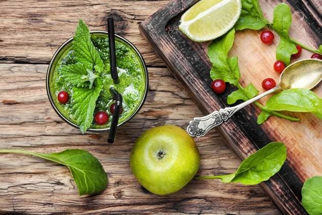Freshly spinach smoothie. Blended green smoothie drink with spinach and ,model released, Symbolfoto