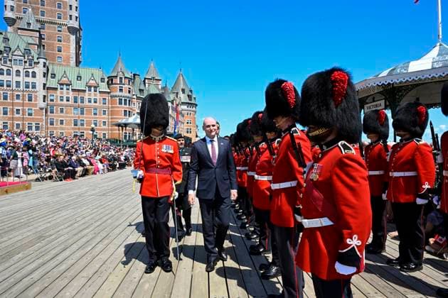 July 1, 2024, Quebec, Pq, Canada: Jean-Yves Duclos, Minister of Public Services and Procurement, inspect the red serge of the Vandoos during Canada Day celebrations on the Dufferin Terrasse in front of the Chateau Frontenac, Monday, July 1, 2024 in Quebec City. Quebec Canada  - ZUMAc35_ 20240701_zaf_c35_034 Copyright: xJacquesxBoissinotx
