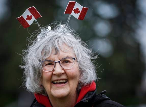 July 1, 2024, Cremona, Ab, CANADA: Barbara MacFarquahar shows her patriotism despite the rain during Canada Day celebrations in Cremona, Alta., Monday, July 1, 2024. Cremona CANADA  - ZUMAc35_ 20240701_zaf_c35_069 Copyright: xJeffxMcintoshx