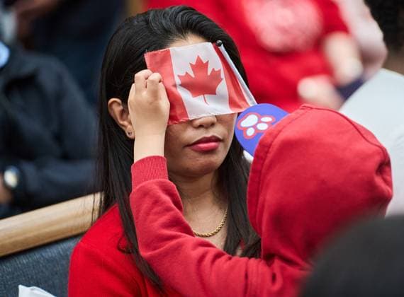 July 1, 2024, Winnipeg, Mb, Canada: Six-year-old Kale plays with a Canadian flag with his mother, Marilou Martin, originally from the Philippines, during a Canada Day citizenship ceremony at the Assiniboine Park Pavilion in Winnipeg, Man., Monday July 1, 2024. Winnipeg Canada - ZUMAc35_ 20240701_zaf_c35_159 Copyright: xDavidxLipnowskix