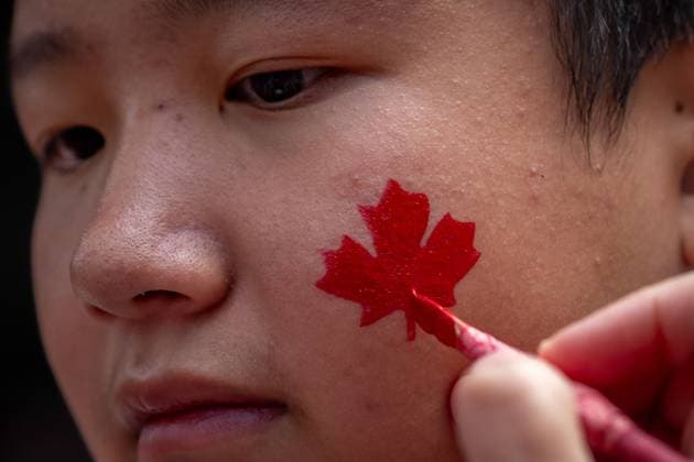 July 1, 2024, Vancouver, Bc, CANADA: A boy is painted with a Canadian flag on Canada ..Day in Vancouver, on Monday, July 1, 2024. Vancouver CANADA  - ZUMAc35_ 20240701_zaf_c35_165 Copyright: xEthanxCairnsx