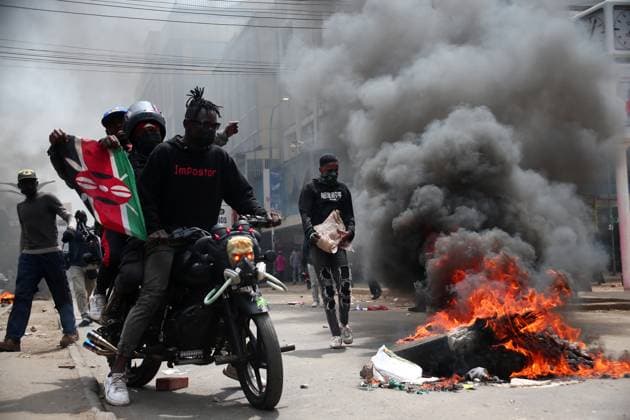 Bilder des Jahres 2024, News 07 Juli News Themen der Woche KW27 News Bilder des Tages July 2, 2024, Nairobi, Nairobi, Kenya: 2nd July 2024, Protesters on a motor bike passing near burning tires along Tom Mboya Street in Nairobi during demonstrations opposing the Finance Bill 2024. Nairobi Kenya - ZUMAw219 20240702_zip_w219_014 Copyright: xKanyirixWahitox