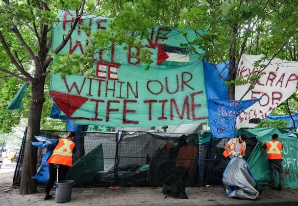 July 5, 2024, Montreal, Pq, CANADA: City workers dismantle tents after police cleared a pro-Palestinian protest encampment in Victoria Square in Montreal, Friday, July 5, 2024. Montreal CANADA  - ZUMAc35_ 20240705_zaf_c35_011 Copyright: xChristinnexMuschix