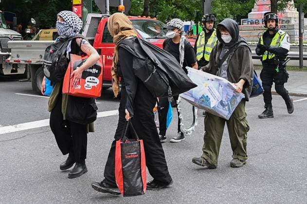 July 5, 2024, Montreal, Pq, Canada: Police escort pro-Palestine supporters away from a protest encampment in Victoria Square in Montreal, Friday, July 5, 2024, following a police intervention earlier in the morning. Montreal Canada  - ZUMAc35_ 20240705_zaf_c35_032 Copyright: xGrahamxHughesx