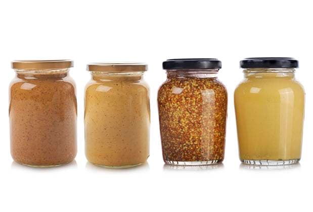 Bottles of Mustard isolated on white background.Yellow mustard,whole grain mustard,stone ground dijon,sweet mustard. ,model released, Symbolfoto