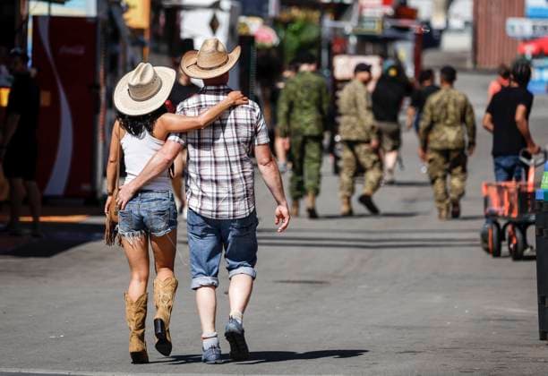 July 6, 2024, Calgary, Ab, CANADA: A couple who arrived early enjoy quiet midway before the crowds arrive at the Calgary Stampede in Calgary, Alta., Saturday, July 6, 2024. Calgary CANADA  - ZUMAc35_ 20240706_zaf_c35_001 Copyright: xJeffxMcintoshx